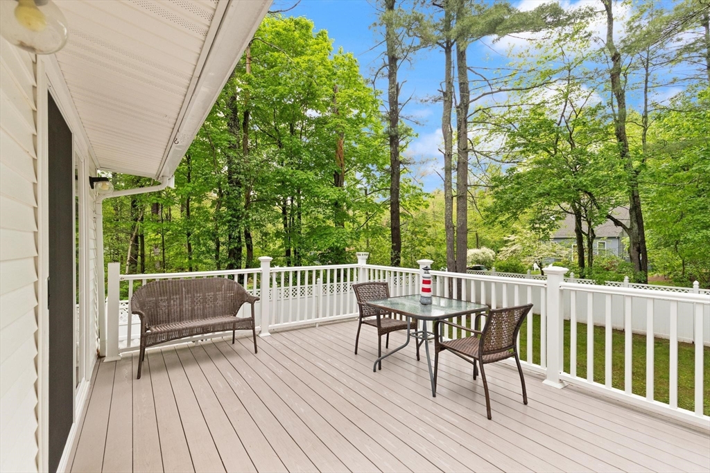901 Haverhill Street Rowley, MA 01969 - Photo 39 of 42 a view of a deck with furniture and a yard