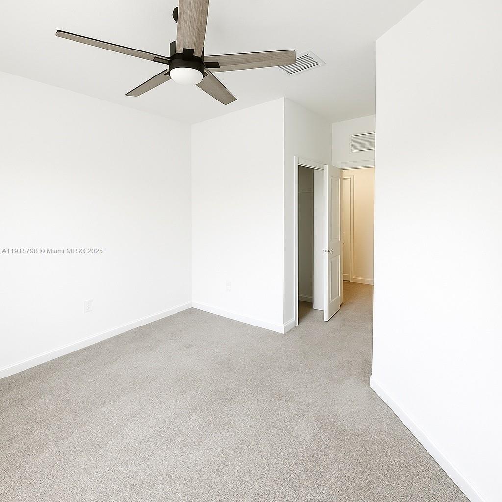 25564 Southwest 108th Avenue, Unit 25564 Homestead, FL 33032 - Photo 13 of 17 a view of a small space with a fan