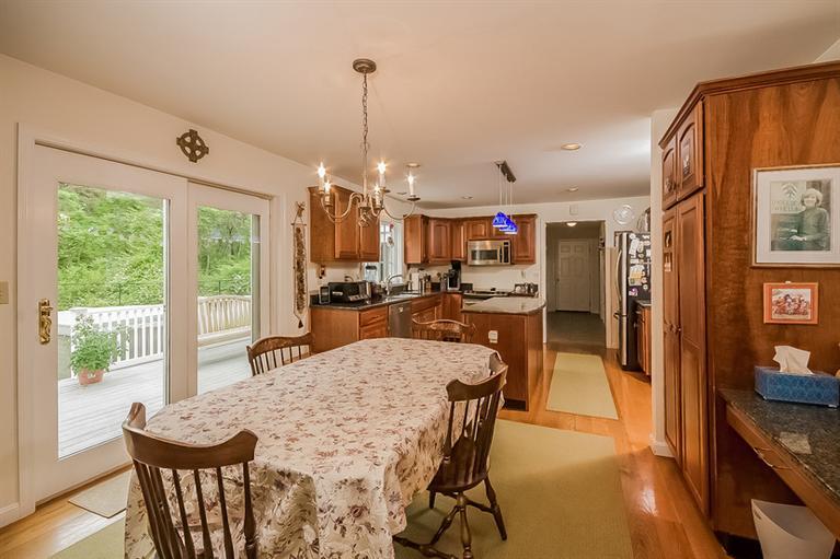 53 Sandy Neck Road East Sandwich, MA 02537 - Photo 11 of 28 a view of a dining room with furniture window and outside view