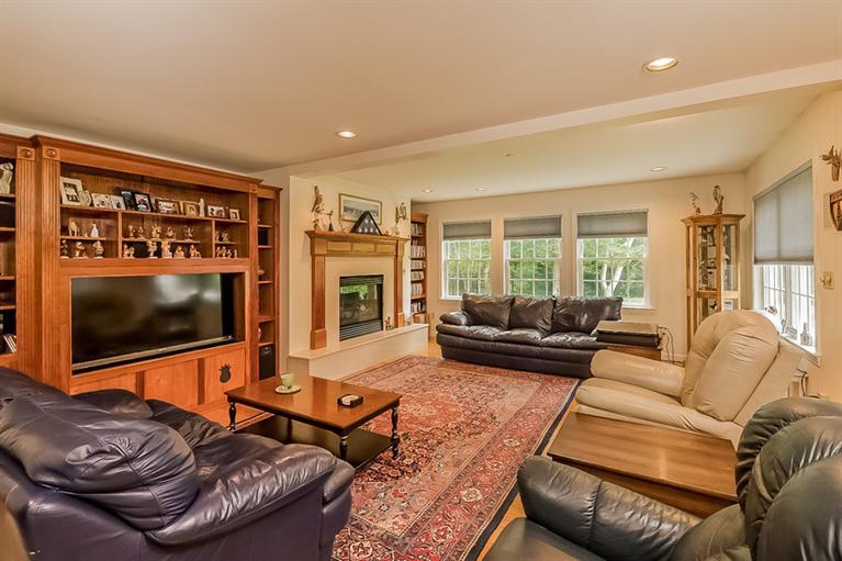 53 Sandy Neck Road East Sandwich, MA 02537 - Photo 12 of 28 a living room with furniture and a flat screen tv