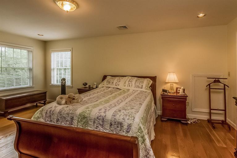 53 Sandy Neck Road East Sandwich, MA 02537 - Photo 19 of 28 a bedroom with a bed and window