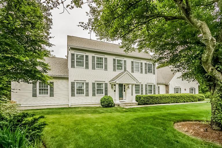 53 Sandy Neck Road East Sandwich, MA 02537 - Photo 2 of 28 a front view of a house with a yard