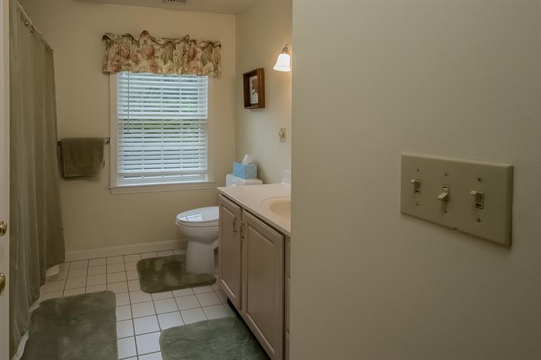53 Sandy Neck Road East Sandwich, MA 02537 - Photo 22 of 28 a bathroom with a toilet sink and a window