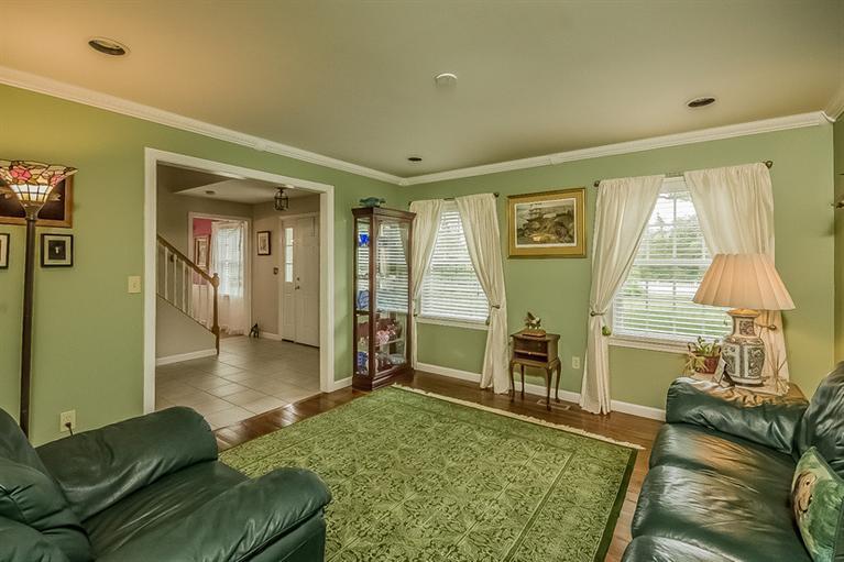 53 Sandy Neck Road East Sandwich, MA 02537 - Photo 8 of 28 a living room with furniture and a table