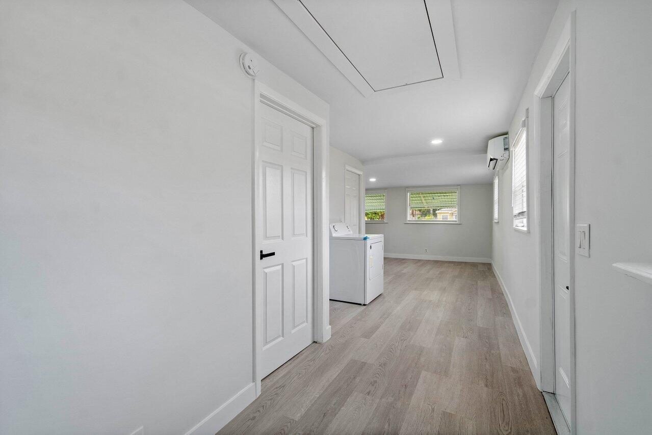 137 Southwest 9th Avenue Delray Beach, FL 33444 - Photo 11 of 27 a view of a hallway with wooden floor