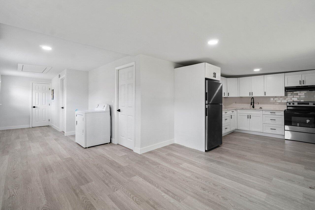137 Southwest 9th Avenue Delray Beach, FL 33444 - Photo 12 of 27 a view of a kitchen with wooden floor