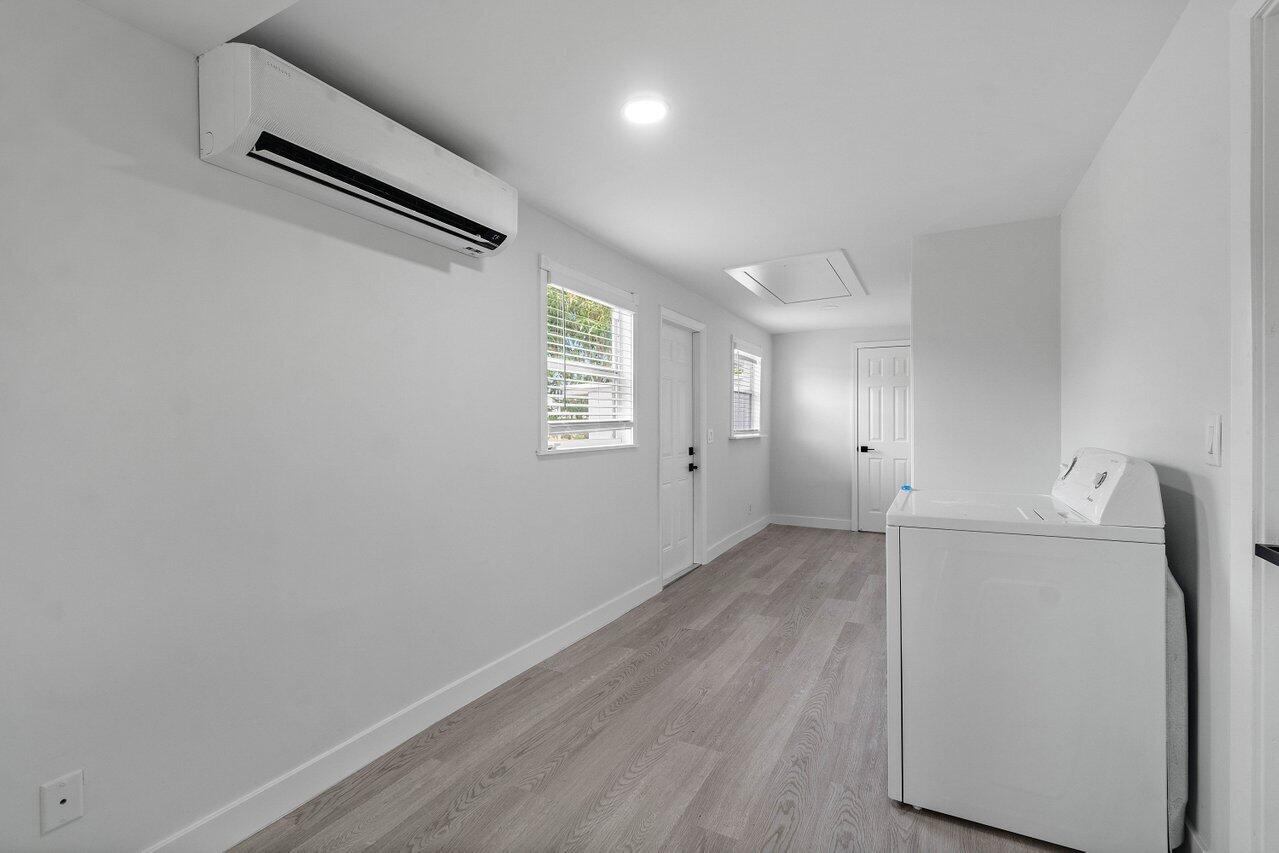 137 Southwest 9th Avenue Delray Beach, FL 33444 - Photo 14 of 27 an empty room with wooden floor and windows