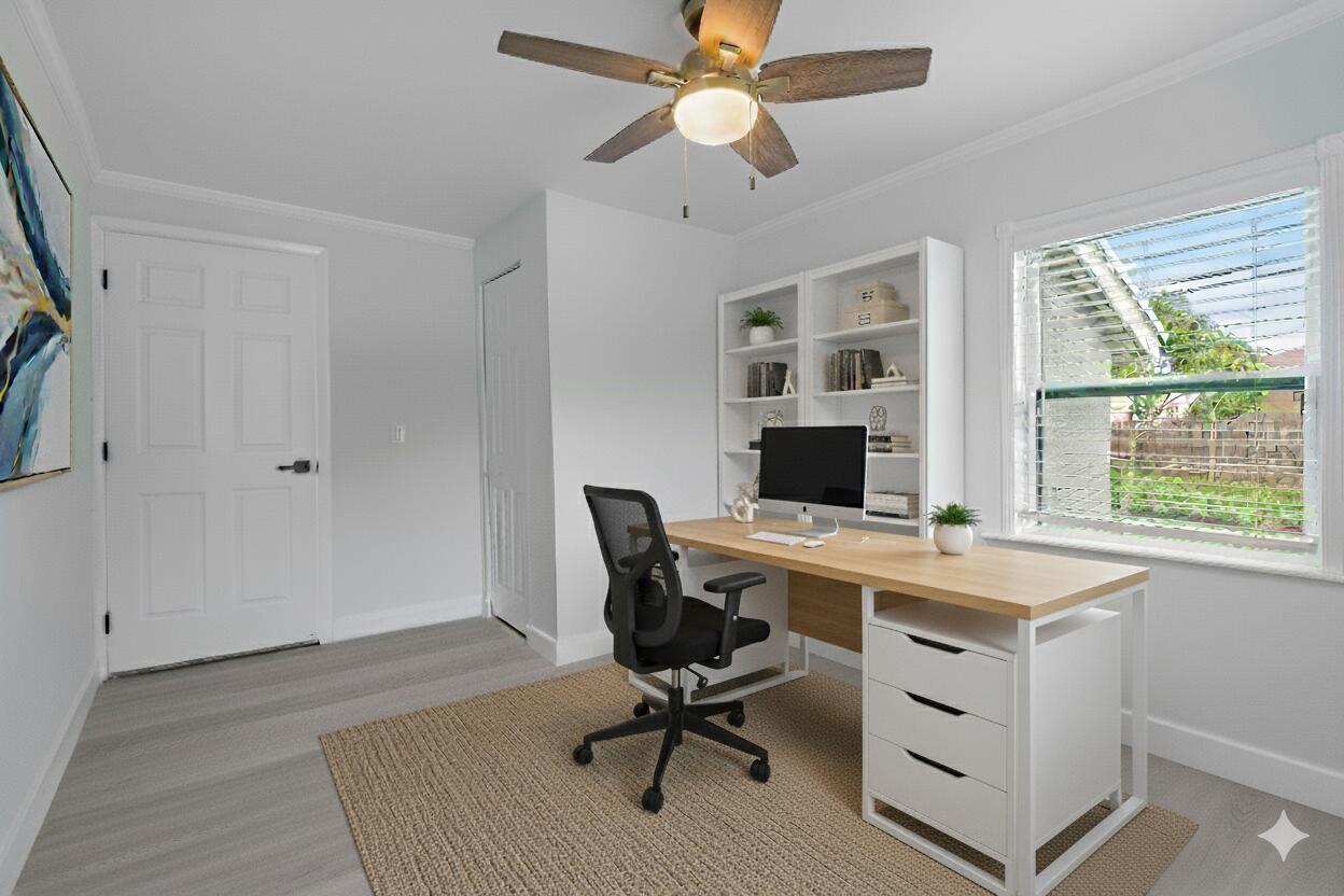 137 Southwest 9th Avenue Delray Beach, FL 33444 - Photo 17 of 27 a view of a workspace with furniture and a window