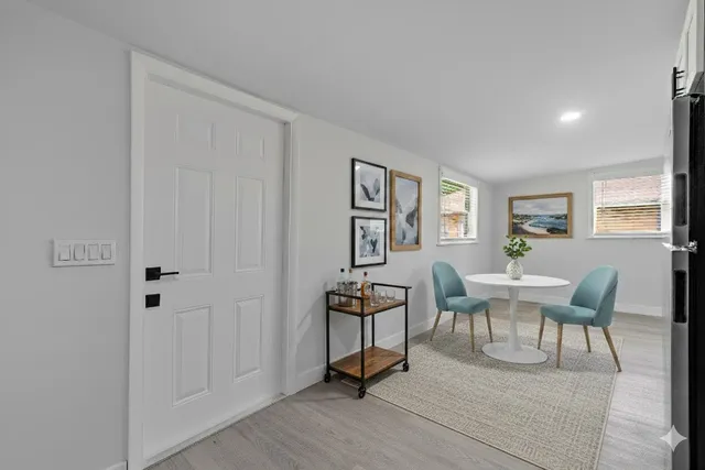 a view of a livingroom with furniture and wooden floor