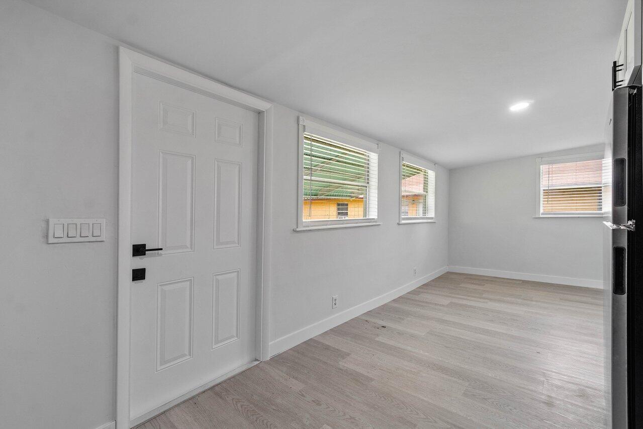 137 Southwest 9th Avenue Delray Beach, FL 33444 - Photo 6 of 27 a view of an empty room with a window