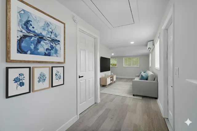 a view of a livingroom with furniture and windows