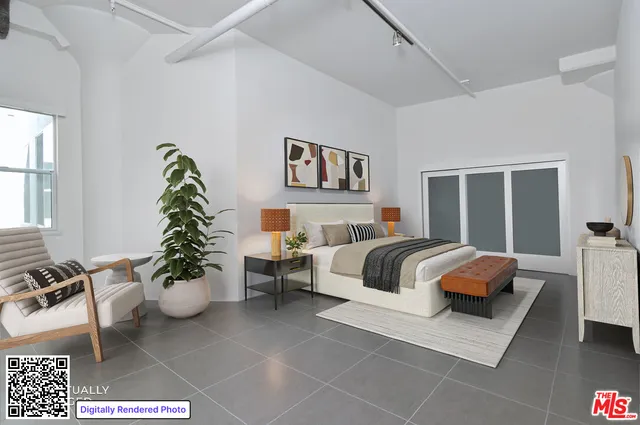 a bedroom with a bed and a couch