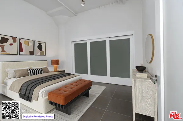 a bedroom with a bed and a mirror