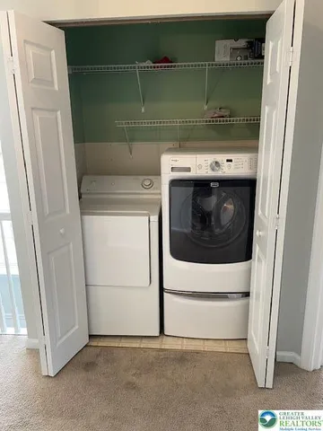 a utility room with washer and dryer
