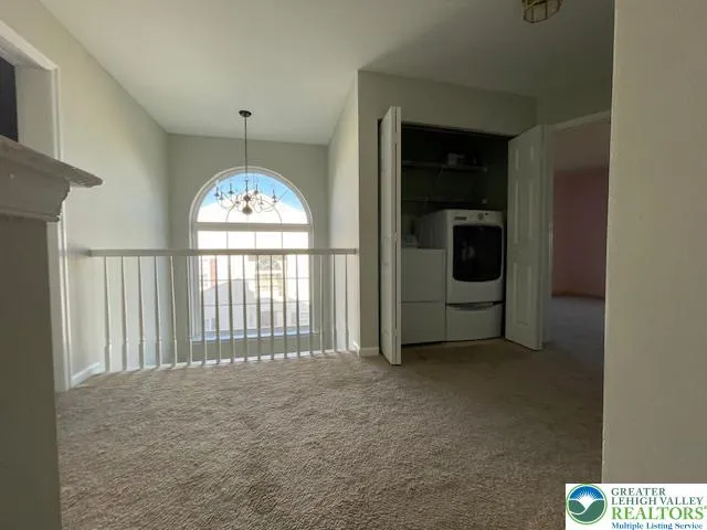 a view of a room with a large window