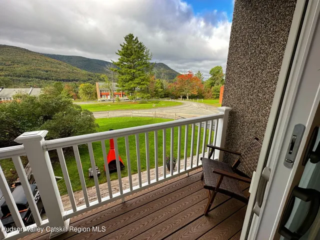 a view of a balcony with wooden floor