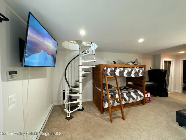 a bedroom with furniture and window