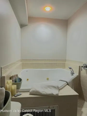 a bathroom with a sink a toilet and bathtub
