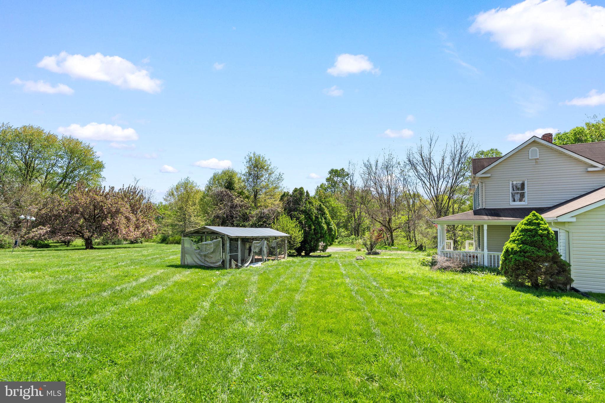 5002 Burkittsville Road Jefferson, MD 21755 - Photo 38 of 40 Spacious lawn under a bright sky.