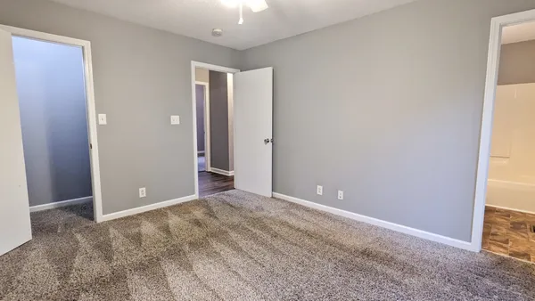 an empty room with closet area