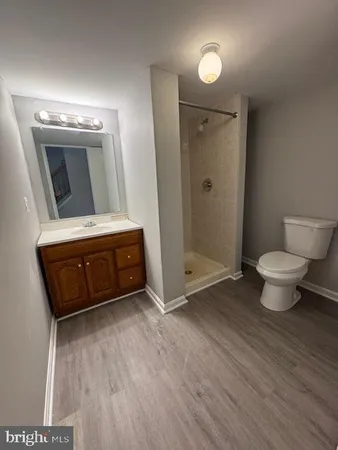 a living room with a toilet and a shower