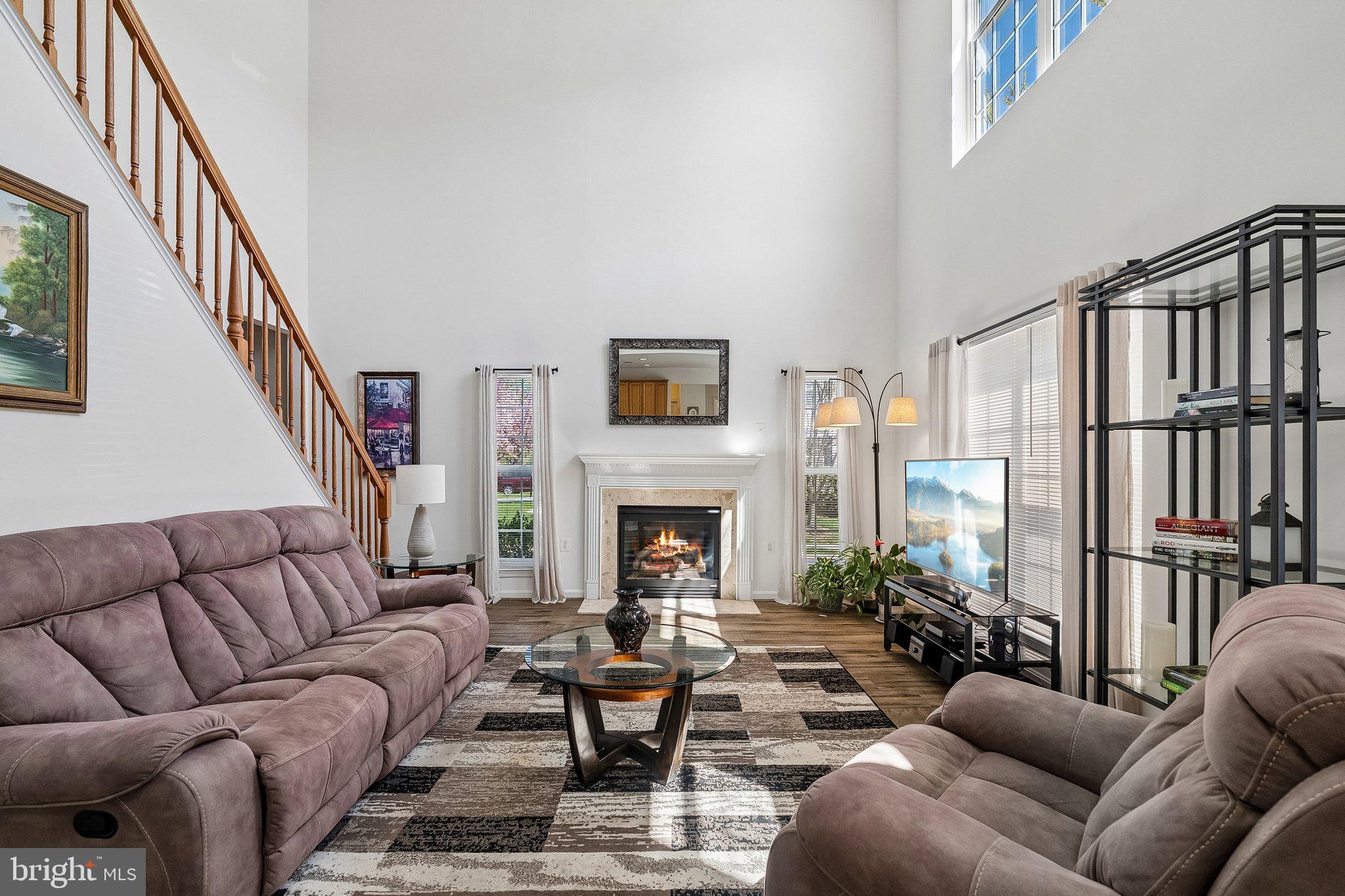 43351 Fullerton Street Ashburn, VA 20147 - Photo 13 of 41 a living room with furniture fireplace and a large window