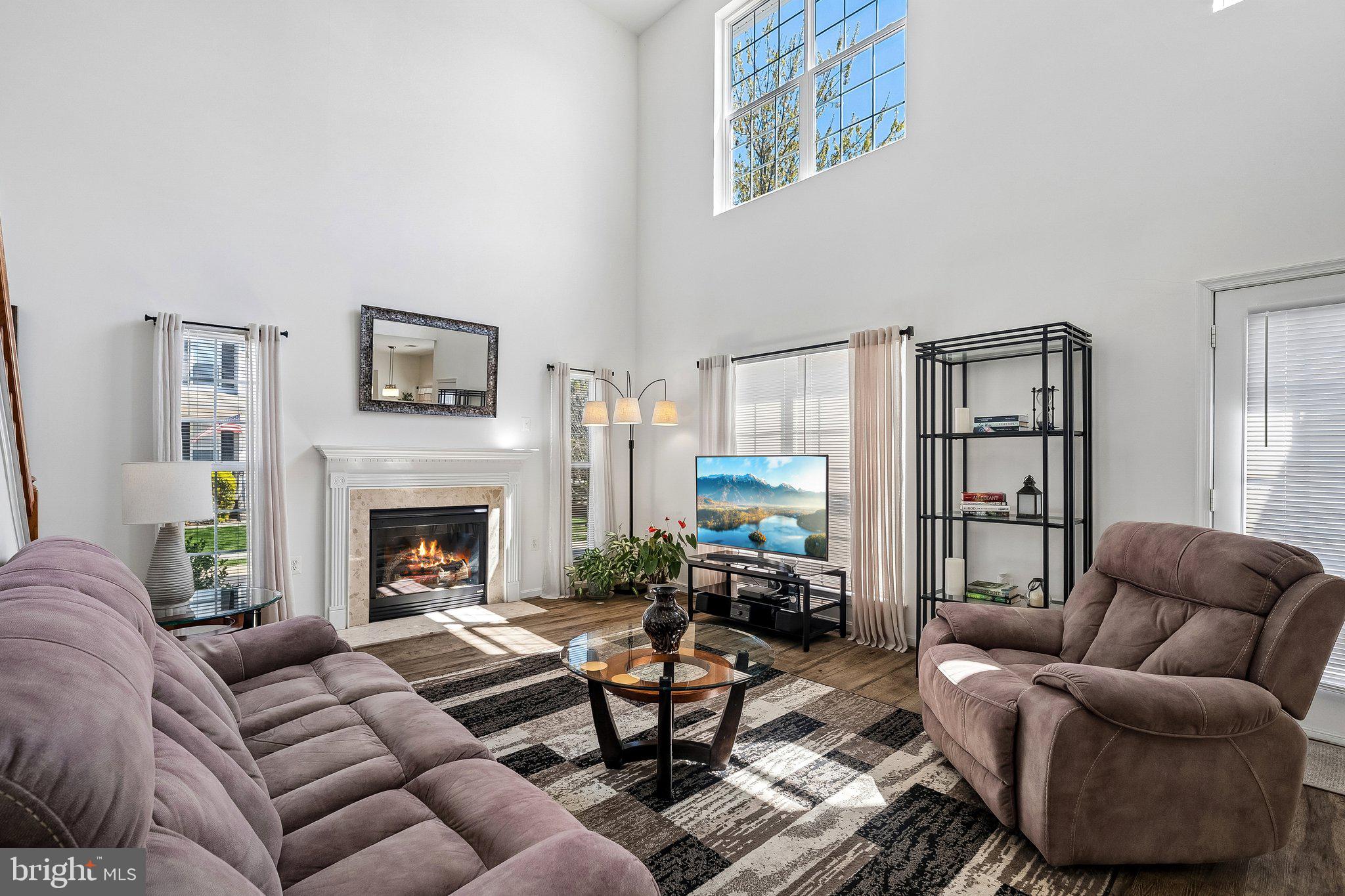 43351 Fullerton Street Ashburn, VA 20147 - Photo 14 of 41 a living room with furniture or couch and a fireplace