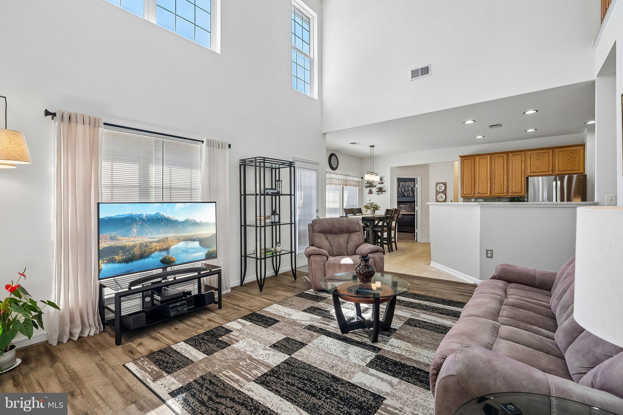 43351 Fullerton Street Ashburn, VA 20147 - Photo 15 of 41 a living room with furniture and a flat screen tv