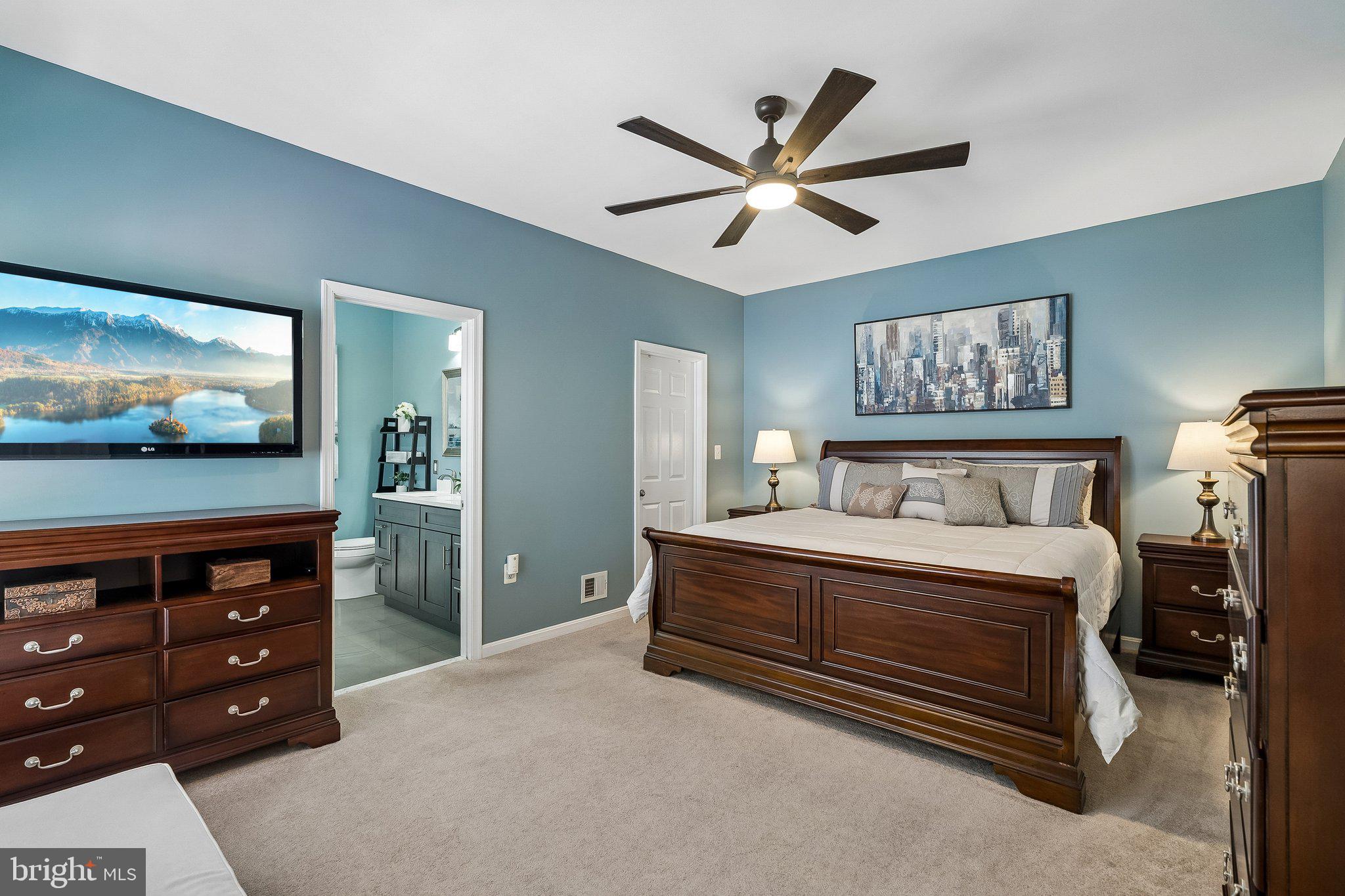 43351 Fullerton Street Ashburn, VA 20147 - Photo 17 of 41 a bedroom with a bed and a flat screen tv