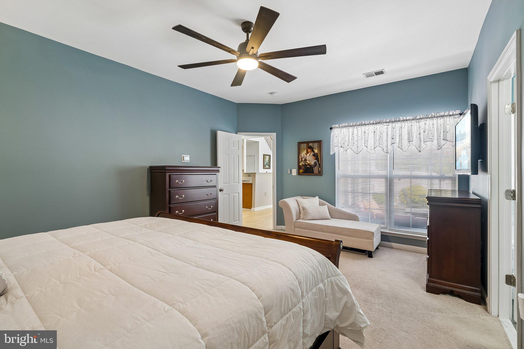 43351 Fullerton Street Ashburn, VA 20147 - Photo 19 of 41 a bedroom with a large bed and a large window