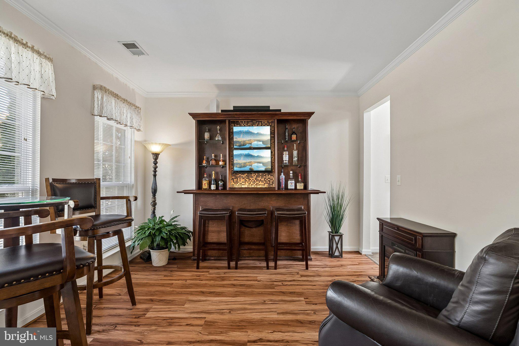 43351 Fullerton Street Ashburn, VA 20147 - Photo 2 of 41 a living room with furniture and a fireplace