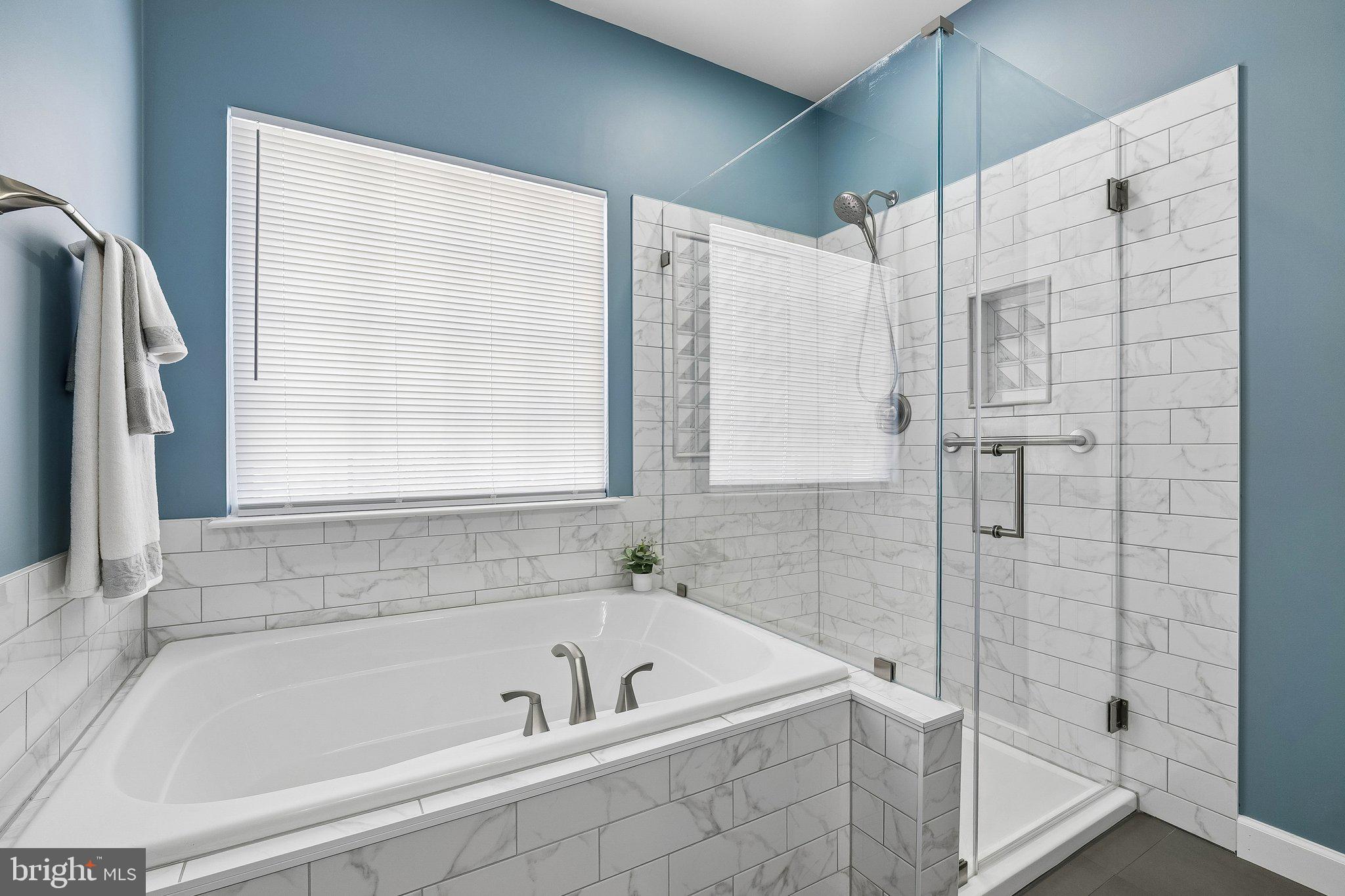 43351 Fullerton Street Ashburn, VA 20147 - Photo 21 of 41 a bathroom with a tub shower and sink