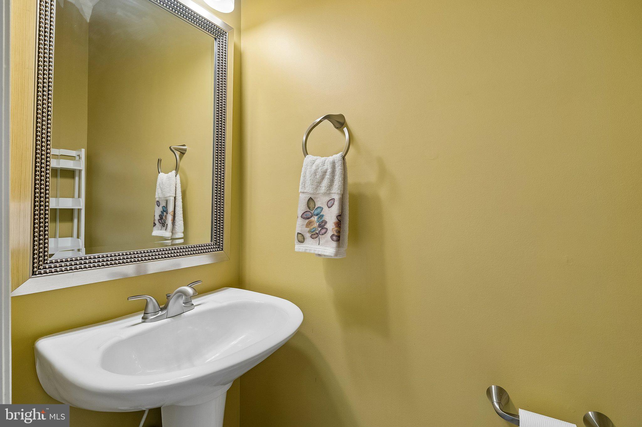 43351 Fullerton Street Ashburn, VA 20147 - Photo 22 of 41 a bathroom with a sink and a mirror