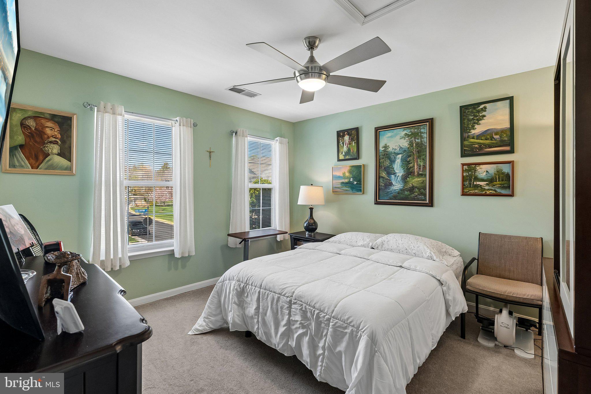 43351 Fullerton Street Ashburn, VA 20147 - Photo 24 of 41 a bedroom with a bed and wooden floor