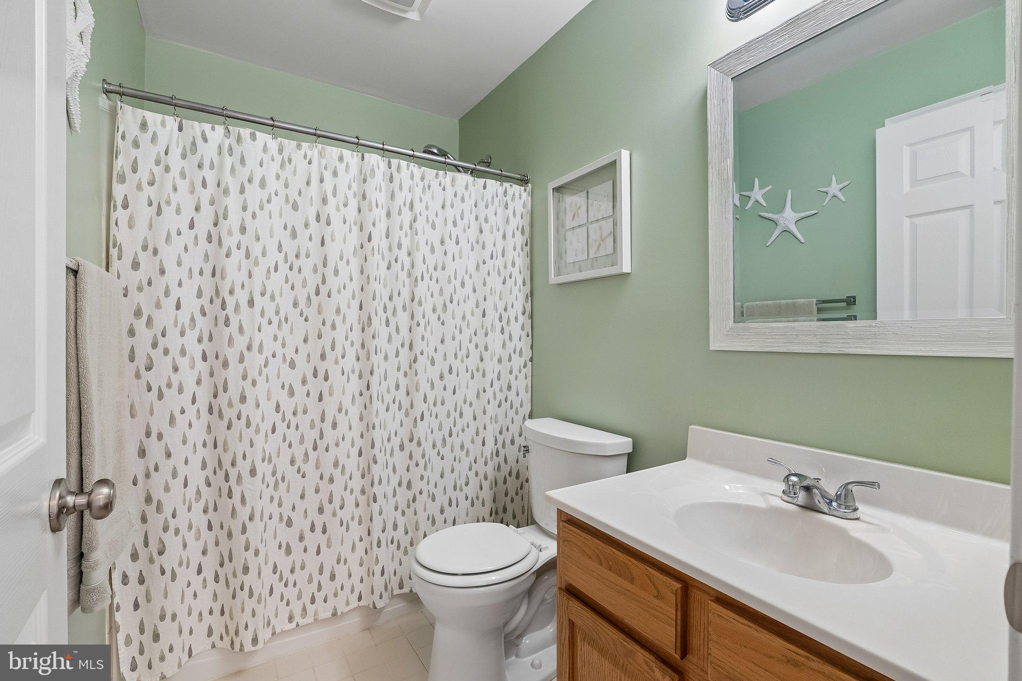 43351 Fullerton Street Ashburn, VA 20147 - Photo 26 of 41 a bathroom with a sink and a mirror