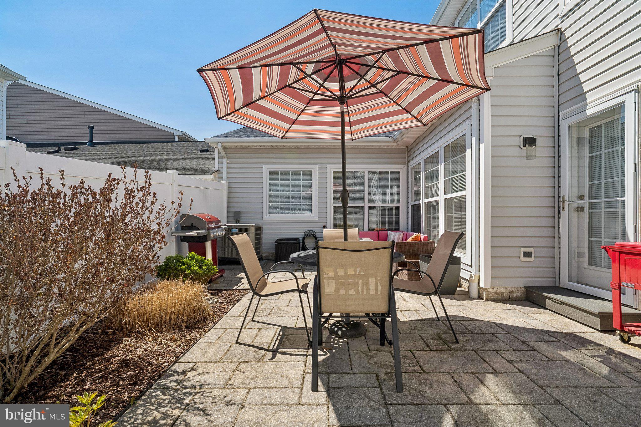 43351 Fullerton Street Ashburn, VA 20147 - Photo 27 of 41 a patio with table and chairs and potted plants