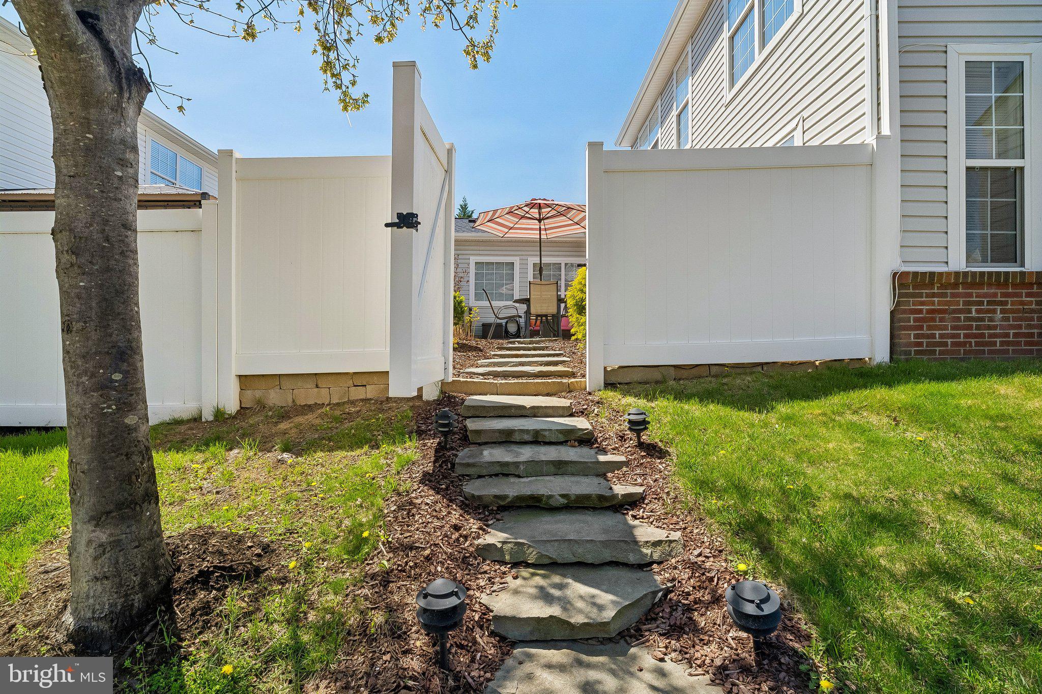 43351 Fullerton Street Ashburn, VA 20147 - Photo 30 of 41 a view of a pathway of the house