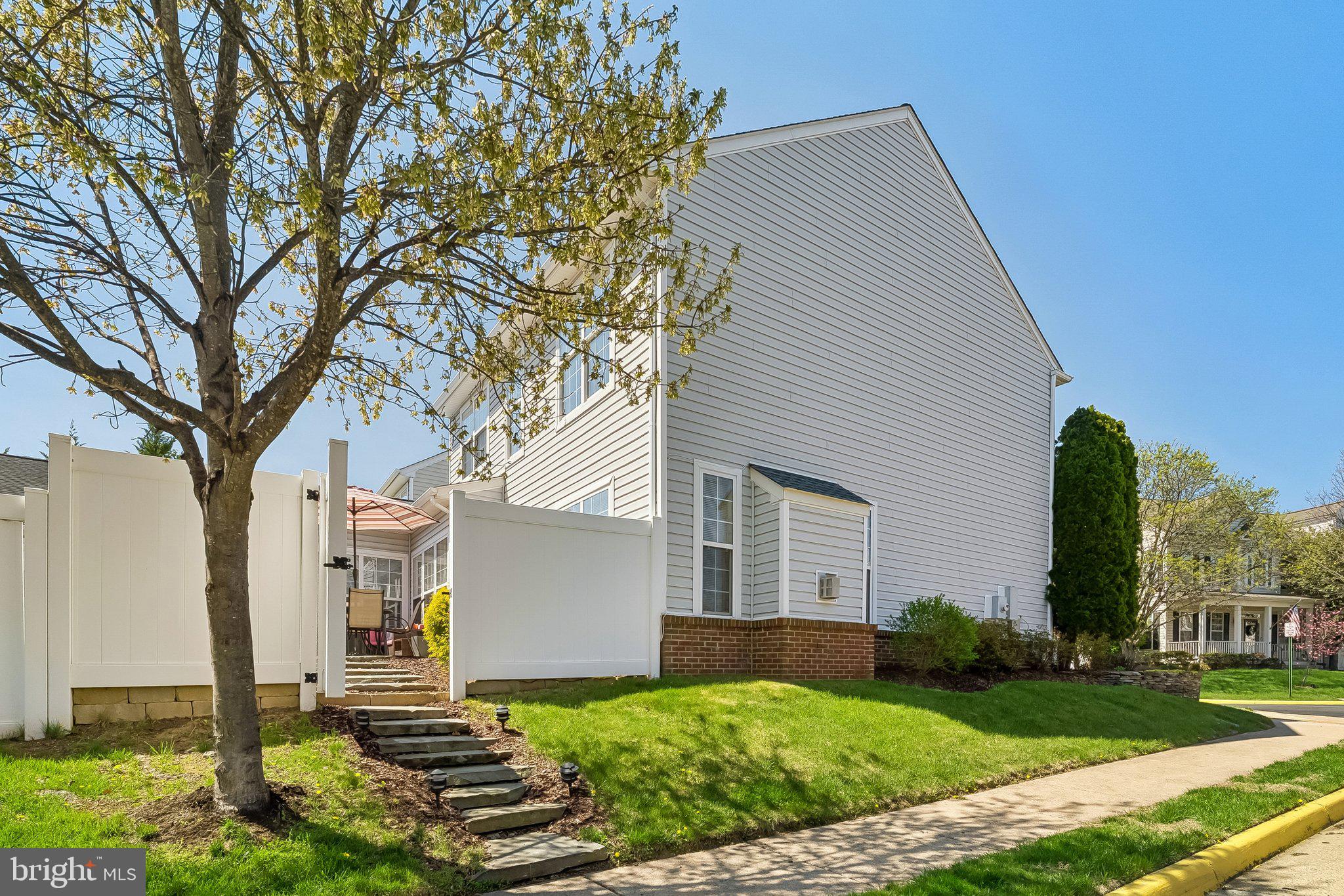 43351 Fullerton Street Ashburn, VA 20147 - Photo 31 of 41 a front view of a house with garden