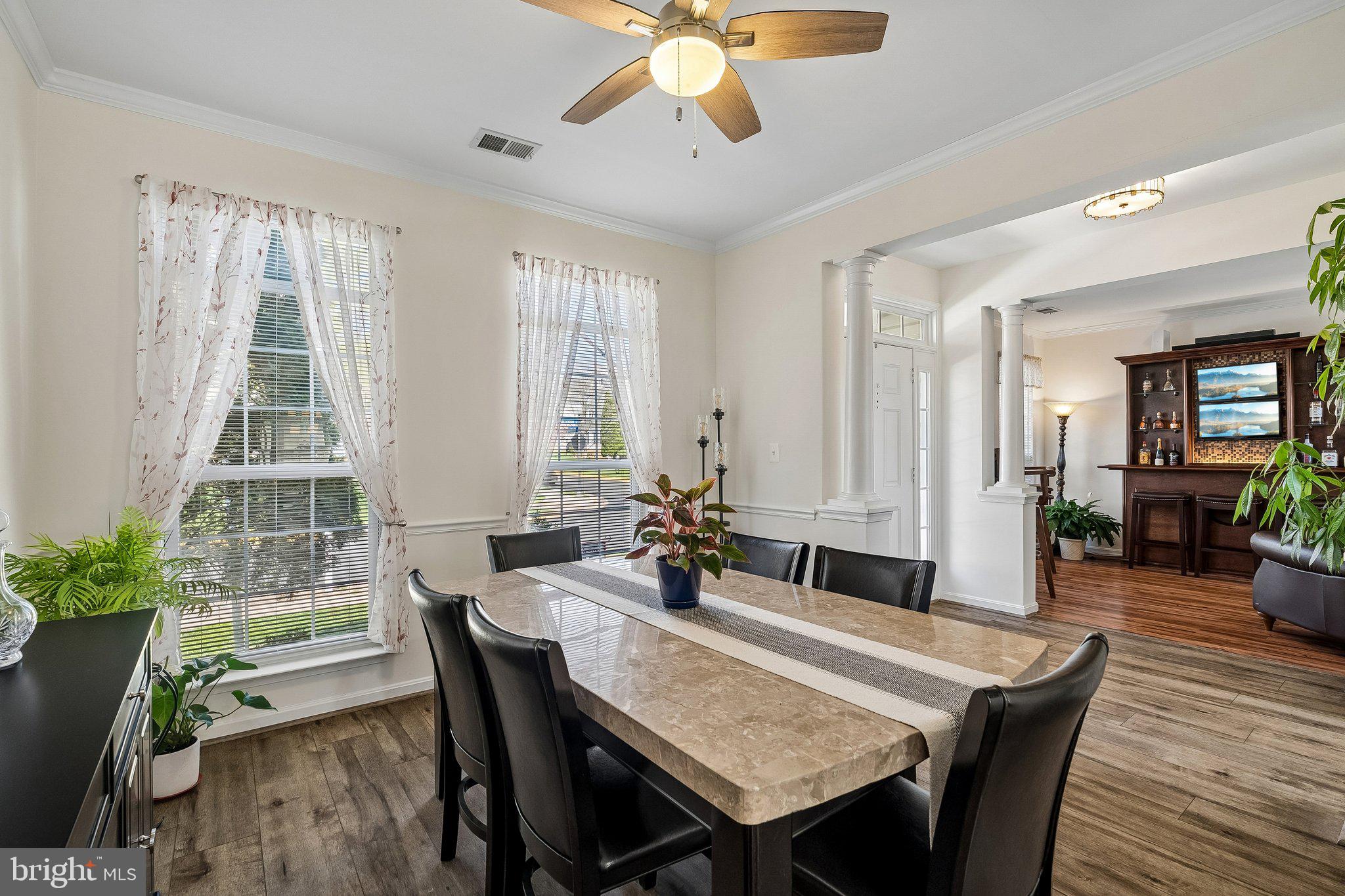 43351 Fullerton Street Ashburn, VA 20147 - Photo 6 of 41 a view of a a dining room with furniture window and wooden floor