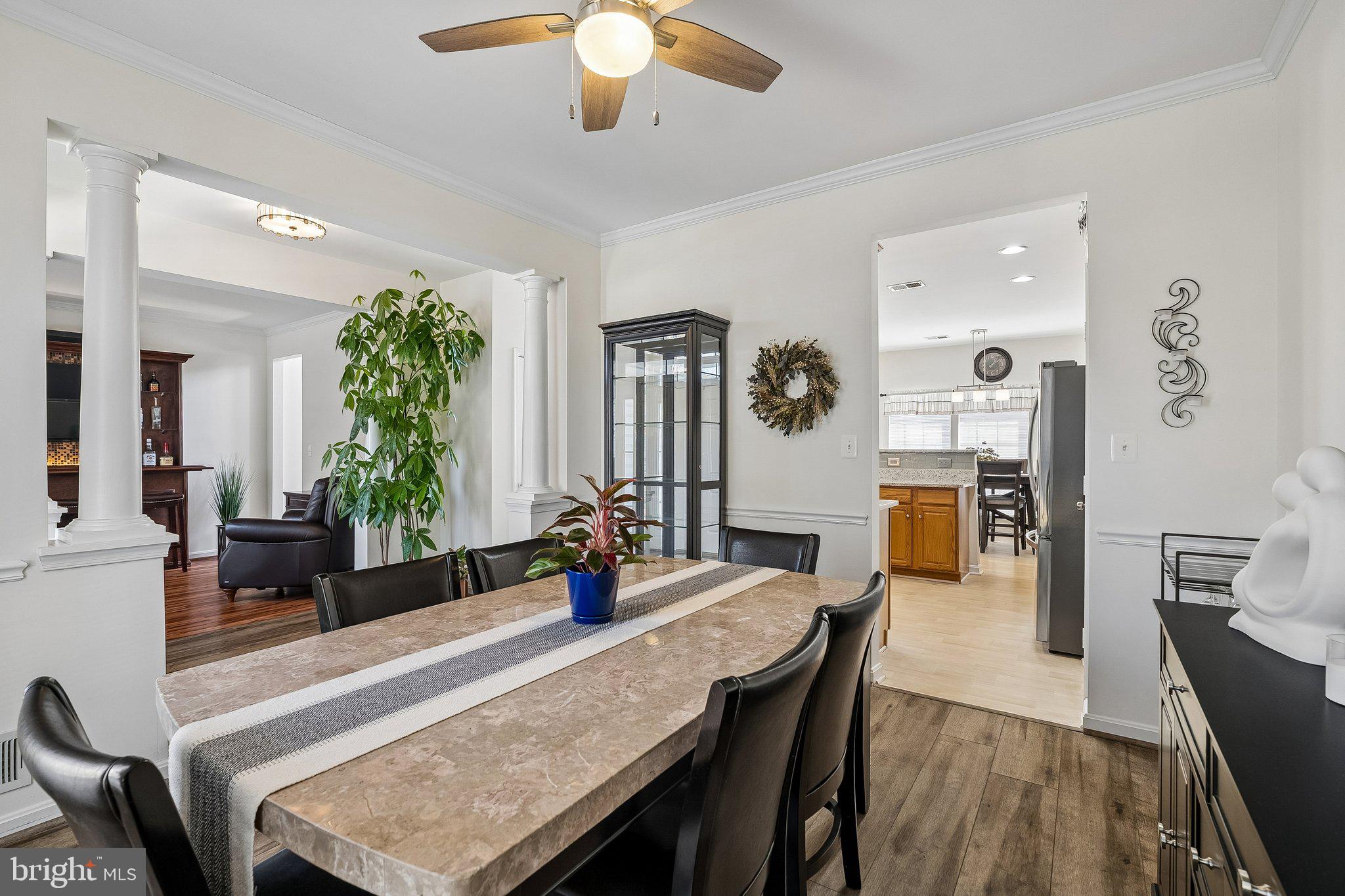 43351 Fullerton Street Ashburn, VA 20147 - Photo 7 of 41 a view of a dining room with furniture and wooden floor