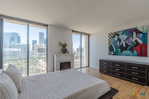 a bedroom with a bed and a fireplace