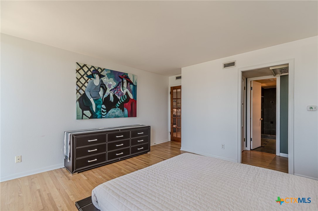1122 Colorado Street, Unit 1409 Austin, TX 78701 - Photo 14 of 32 a living room with furniture and a flat screen tv