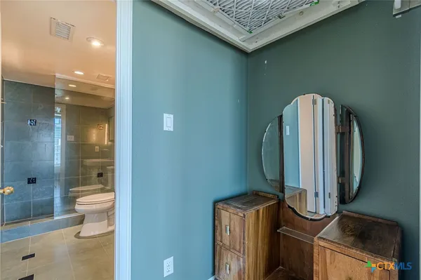 a bathroom with a toilet sink and shower