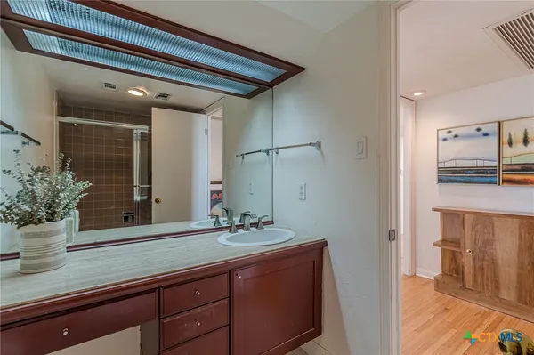 a bathroom with a sink and a mirror