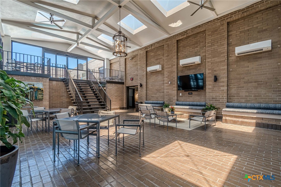 1122 Colorado Street, Unit 1409 Austin, TX 78701 - Photo 27 of 32 a outdoor space with lots of table and chairs