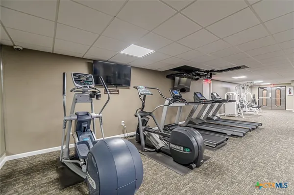 a view of a room with gym equipment