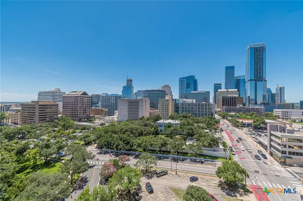 a view of a city with tall buildings