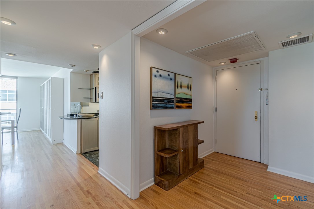 1122 Colorado Street, Unit 1409 Austin, TX 78701 - Photo 4 of 32 a view of open kitchen with a sink stove and refrigerator