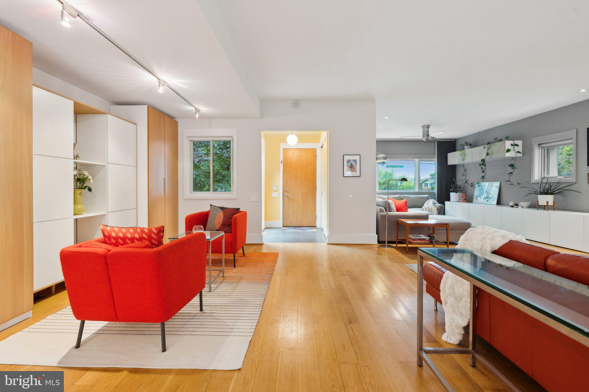 5929 Onondaga Road Bethesda, MD 20816 - Photo 11 of 47 a living room with furniture a rug and a large window