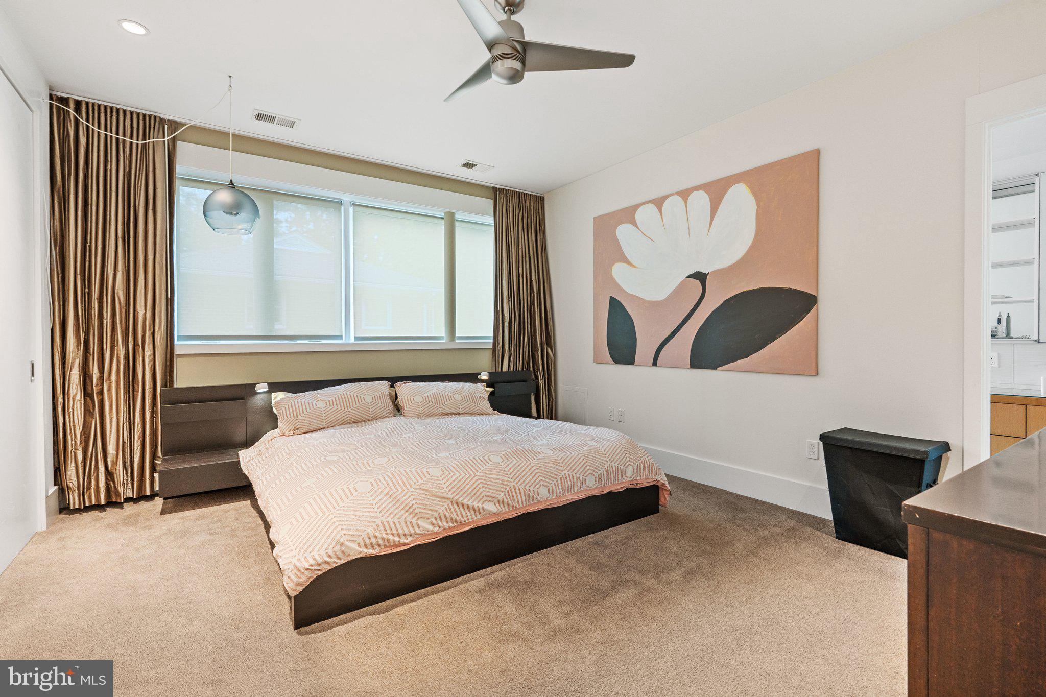 5929 Onondaga Road Bethesda, MD 20816 - Photo 16 of 47 a bedroom with a bed and a large window